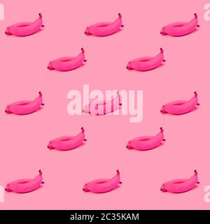 trend pattern with pink bananas on a pink background, the concept of minimalism Stock Photo