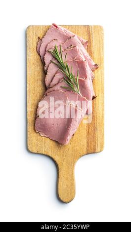 Sliced roast beef on cutting board. Tasty fresh meat isolated on white backgrund. Stock Photo