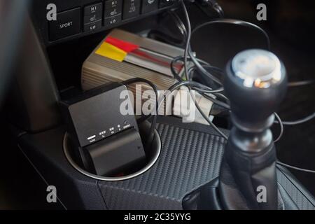 Charging camera batteries on a road trip in the car using AC inverter Stock Photo