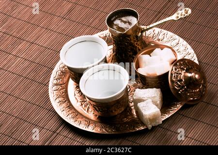 Traditional Turkish coffee set with two cups of coffee on table. Stock Photo