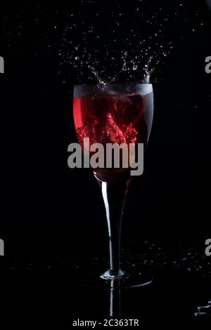 Apple juice splash on black background Stock Photo