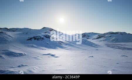 Aerial Landscape of snowy mountains and icy shores in Antarctica Stock Photo