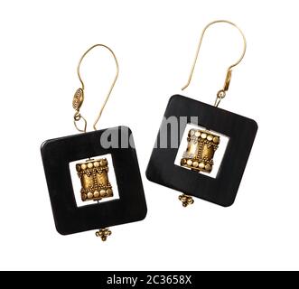 handmade earrings from traditional indian brass items and horn frame isolated on white background Stock Photo