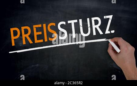 Preissturz (in german Price fall) is written by hand on blackboard. Stock Photo