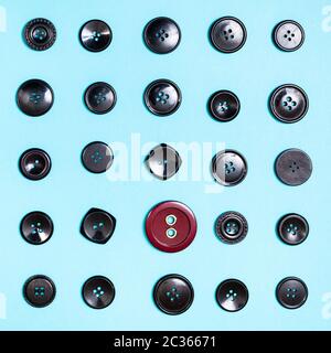 top view of different button between black buttons on blue background Stock Photo