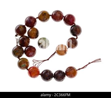 string of beads from cracked agate gemstone isolated on white background Stock Photo