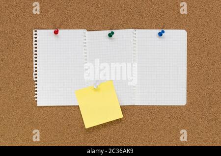 Cork board and note papers, close up image Stock Photo