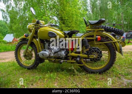 Restored bright green retro motorcycle with sidecar Stock Photo