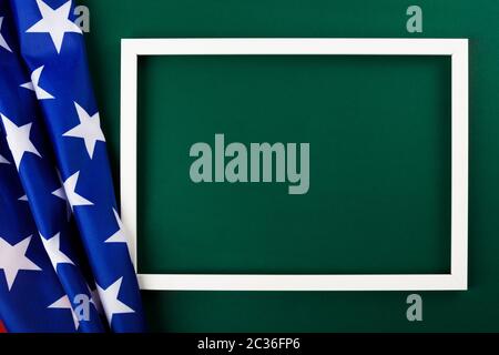 President's Day Concept, flat lay top view, America Flag and photo frame on Olive green background with copy space for your text Stock Photo