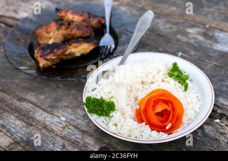 The plate with boiled rices on the old table Stock Photo