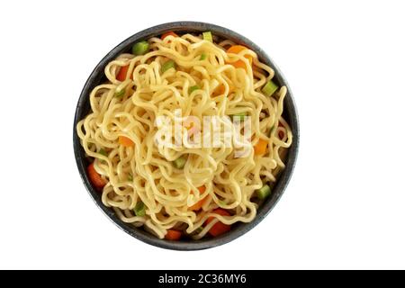 Instant noodles, isolated on a white background with a clipping path. Vegetable soba bowl with carrot and scallions, shot from t Stock Photo