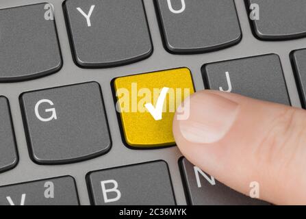 Computer keyboard with agreement key Stock Photo