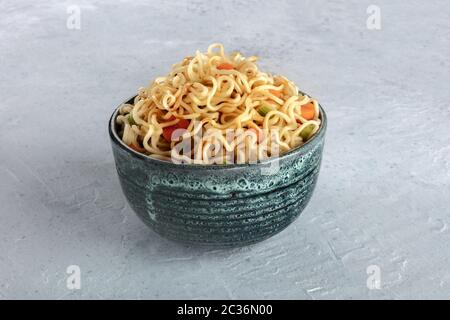 Instant noodles with carrot, scallions, and a sauce, a vegetable soba bowl Stock Photo