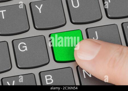 Computer notebook keyboard with blank green key Stock Photo