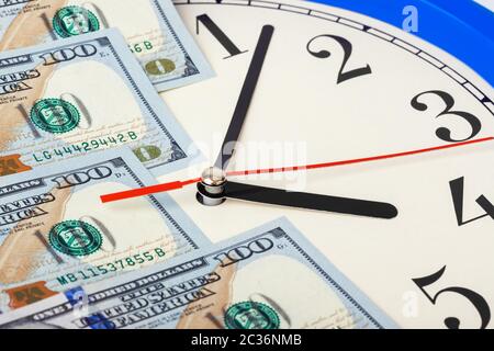 Clock and money - business concept Stock Photo