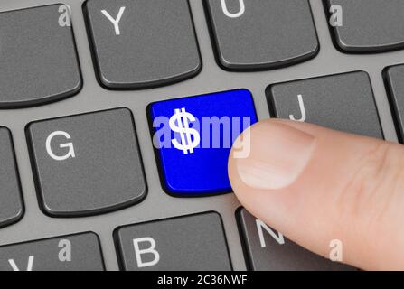 Computer keyboard with money key Stock Photo