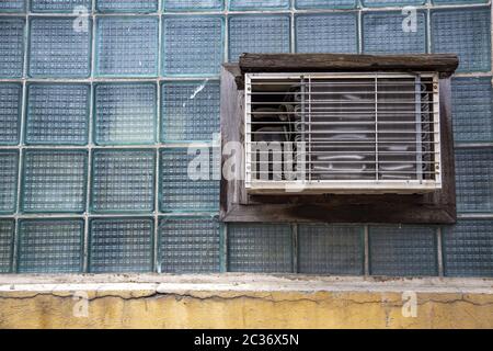 Old air conditioner on a house wall Stock Photo