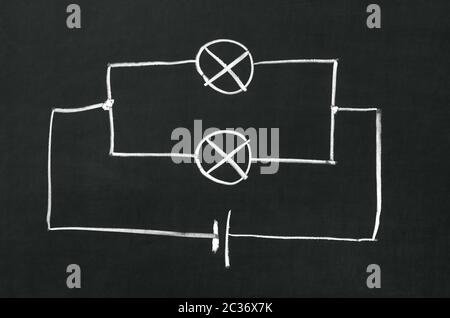 The electrical diagram drawn on a blackboard with chalk Stock Photo