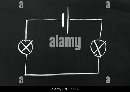 The electrical diagram drawn on a blackboard with chalk Stock Photo