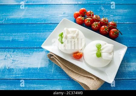 Burrata cheese with cherry peppers Stock Photo