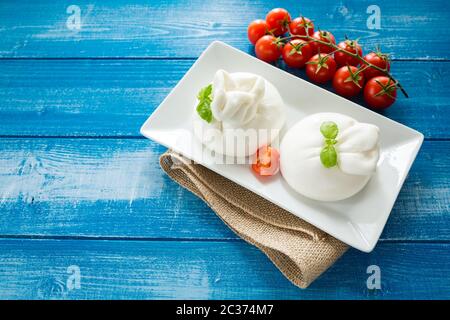 Burrata cheese with cherry peppers Stock Photo