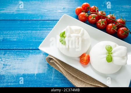 Burrata cheese with cherry peppers Stock Photo