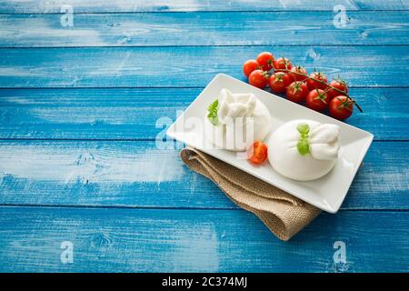 Burrata cheese with cherry peppers Stock Photo