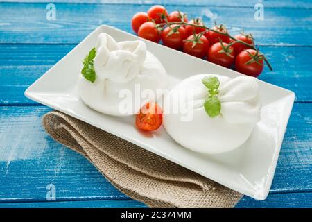 Burrata cheese with cherry peppers Stock Photo