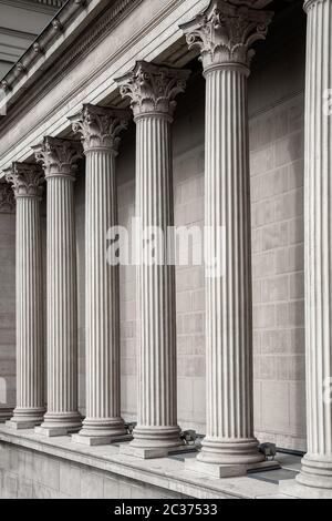 Vintage Old Justice Courthouse Column. Neoclassical colonnade with corinthian columns as part of a public building resembling a Stock Photo