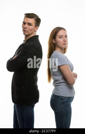 The couple got into a fight and standing with their backs to each other in the frame Stock Photo
