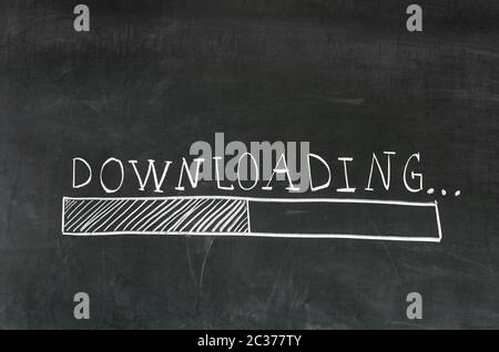 Downloading handwritten with white chalk on a blackboard and drawing download bar Stock Photo