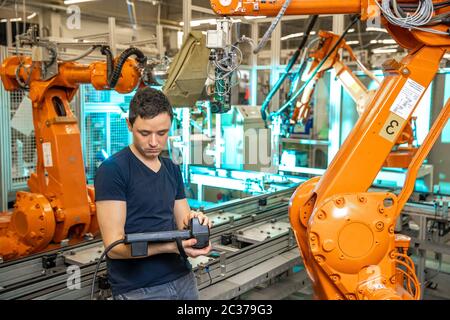 robot diagnostics using special software in the factory. Stock Photo