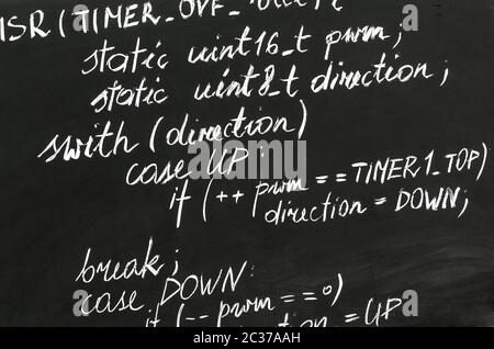 A detail of computer code in AVR explained with white chalk Stock Photo