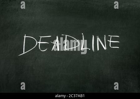 Word 'Deadline' writed on blackboard with chalk Stock Photo