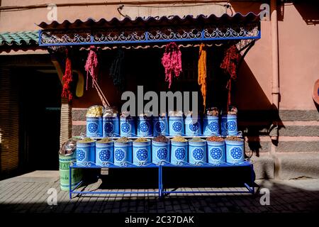 Traditional Moroccan oriental spices and dried herbs in colorful bags for sale in Marrakech medina souk. Morocco street market in old town Stock Photo