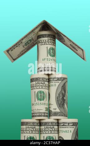 Pyramid of hundred dollar bills with a roof on a white background Stock Photo