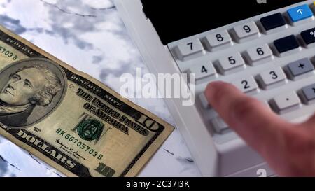 Cashier counts the money in the Bank. Accountant beats check after payment of money.Counting money on a calculator.An office worker counts the money i Stock Photo