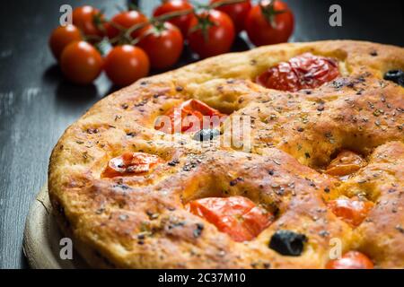 Homemade focaccia on rustic board Stock Photo