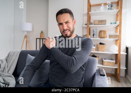 Man Suffering From Shoulder Pain After Injury Stock Photo