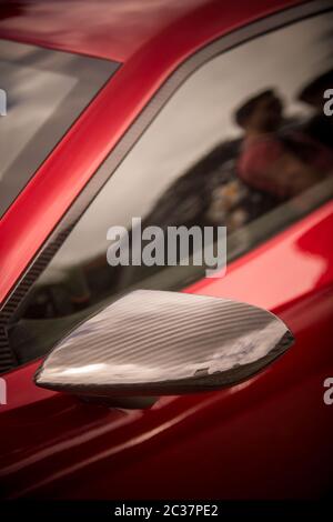 Detail of rear view mirror with carbon optic fairing with coloured ...
