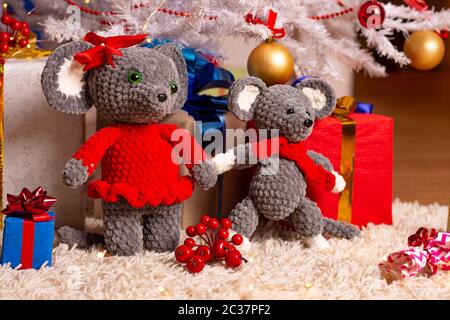 Two funny plush mice under the Christmas tree Stock Photo
