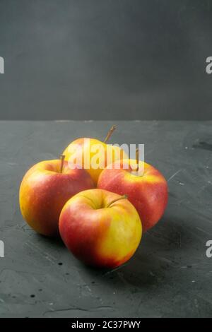 Apples on black stone table background. Front views Stock Photo