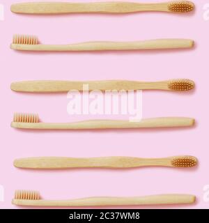 Top view of organic zero waste bamboo toothbrushes on pink background Stock Photo