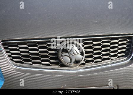 The company logo on the front of a Holden car parked in the sales yard at the Holden Suttons car dealership at 112 Parramatta Road, Homebush, western Stock Photo