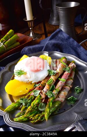 delicious green asparagus wrapped in bacon and egg Stock Photo