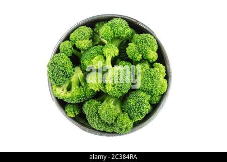 A bowl of cooked broccoli, isolated on a white background with a clipping path, shot from the top Stock Photo