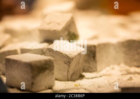 Pieces of Turkish delight on a shop window in Turkey shot with selective focus Stock Photo