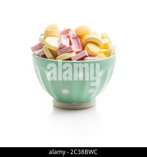 Colorful hard candies in bowl isolated on white background. Stock Photo