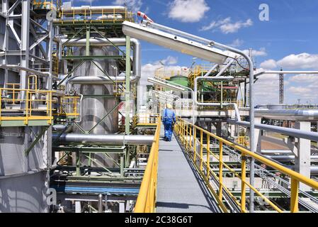 workers in an industrial plant for the production and processing of crude oil Stock Photo