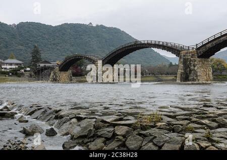 Kintai Bridge over Nishiki river in cloudy day, Iwakuni, Japan Stock Photo